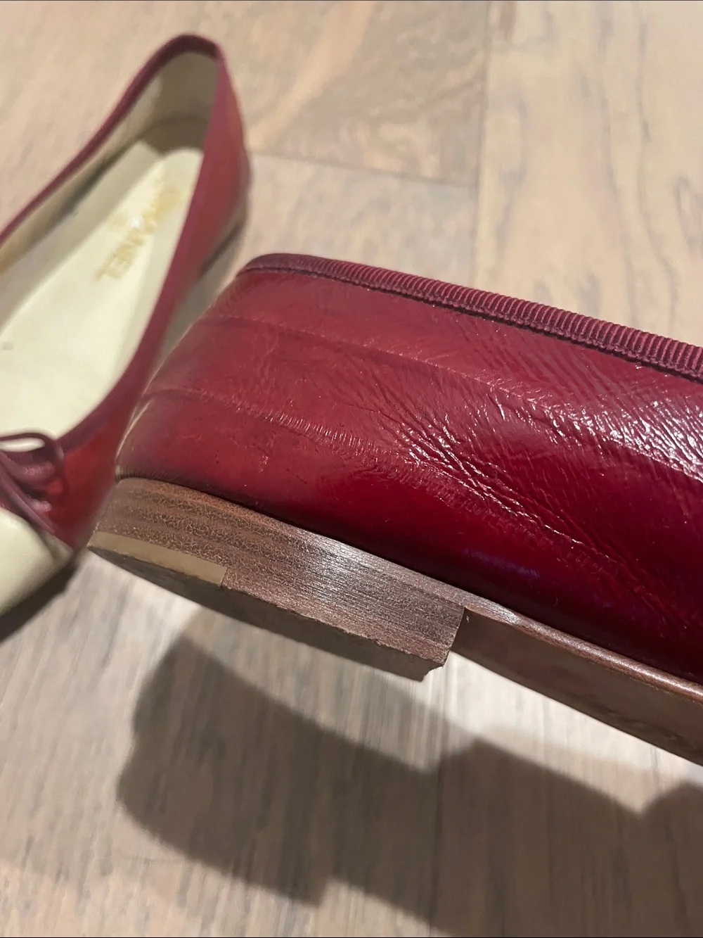 CHANEL Burgundy Eel Skin and Cream Cap-Toe Ballet Flats